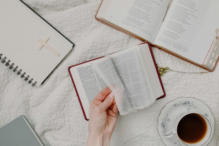 Woman flicking through a Bible.
