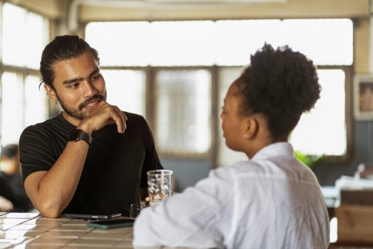 A man and a woman chatting animatedly
