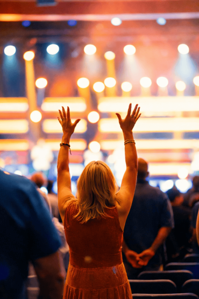 Woman worshipping in a church service.