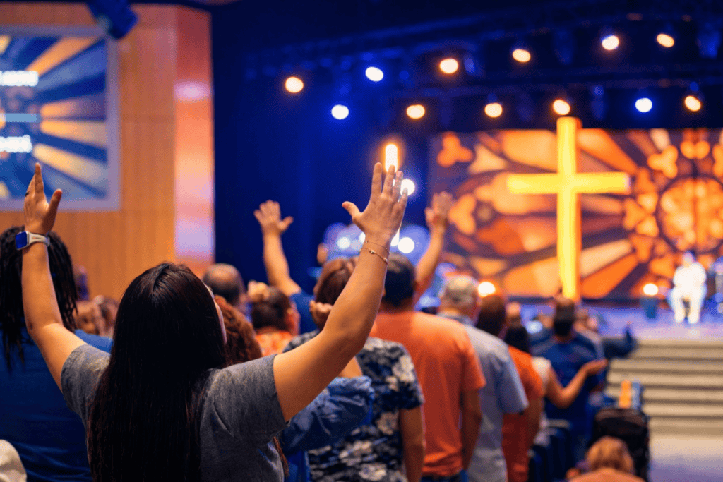Woman worshipping in a church service.