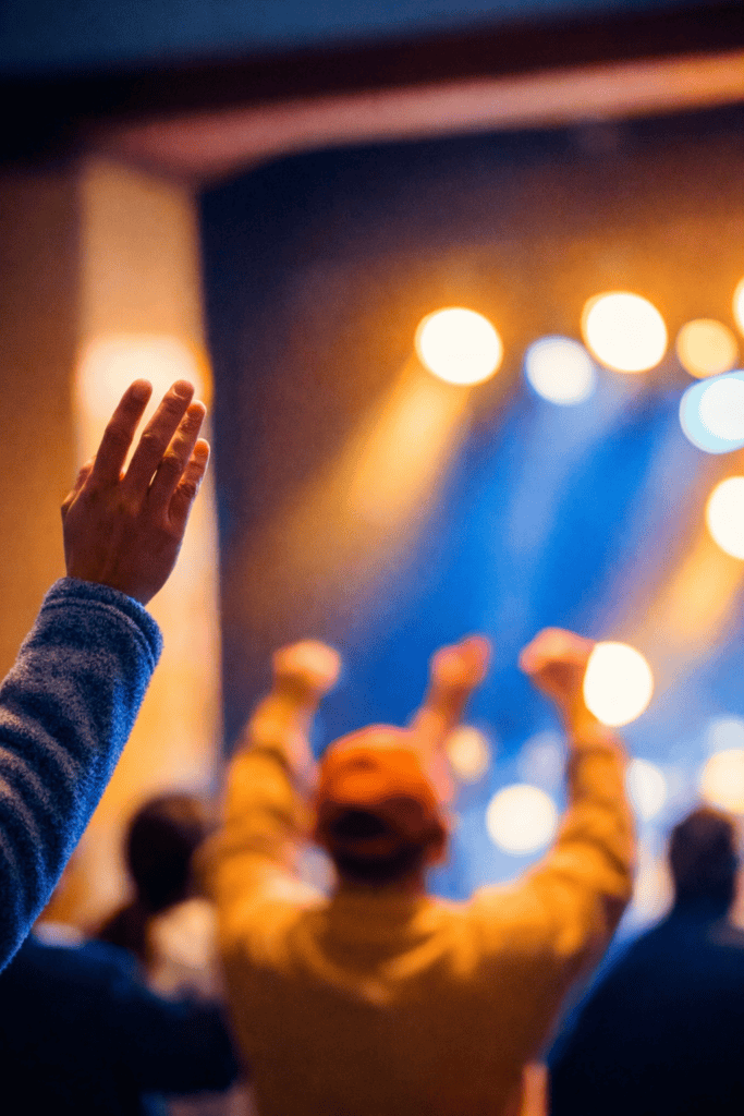 Man worshipping in a church service.
