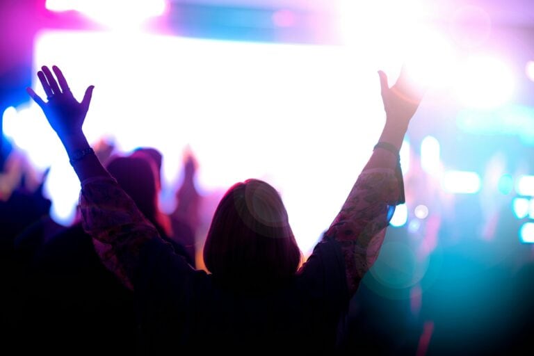 Hands raised in worship.